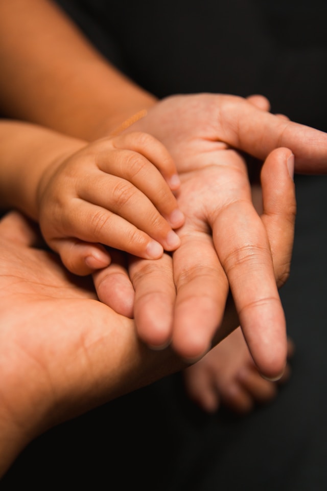 Family holding hands together